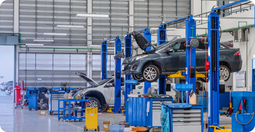 In the image, the cars are lifted and their problems are identified through predictive analysis