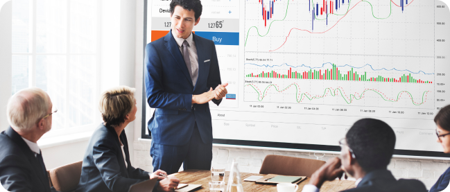 employees evaluate the tables for a series of risk analyses in hand