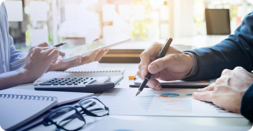 In the image, an employee explains forecast analysis methods at a meeting