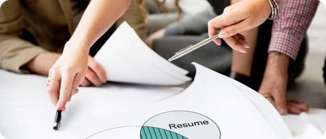 In the image, there are HR personnel evaluating the best CVs as a result of pdata analysis