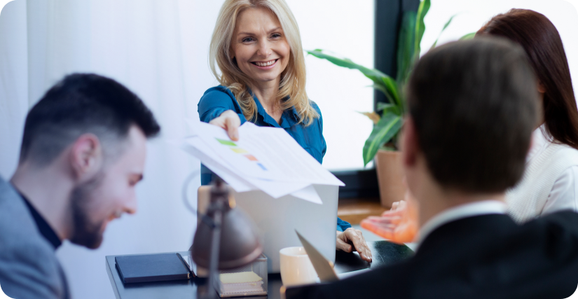 In the image, the HR manager is holding a performance analysis document.
