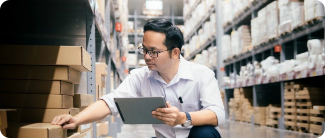 Employee inspects the best products for the customer in the warehouse